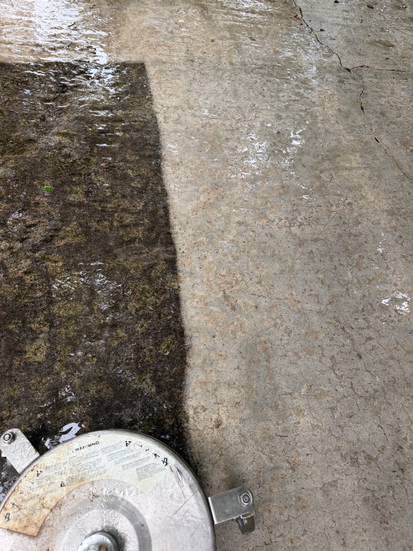 Close-up of a concrete cleaning line during pressure washing