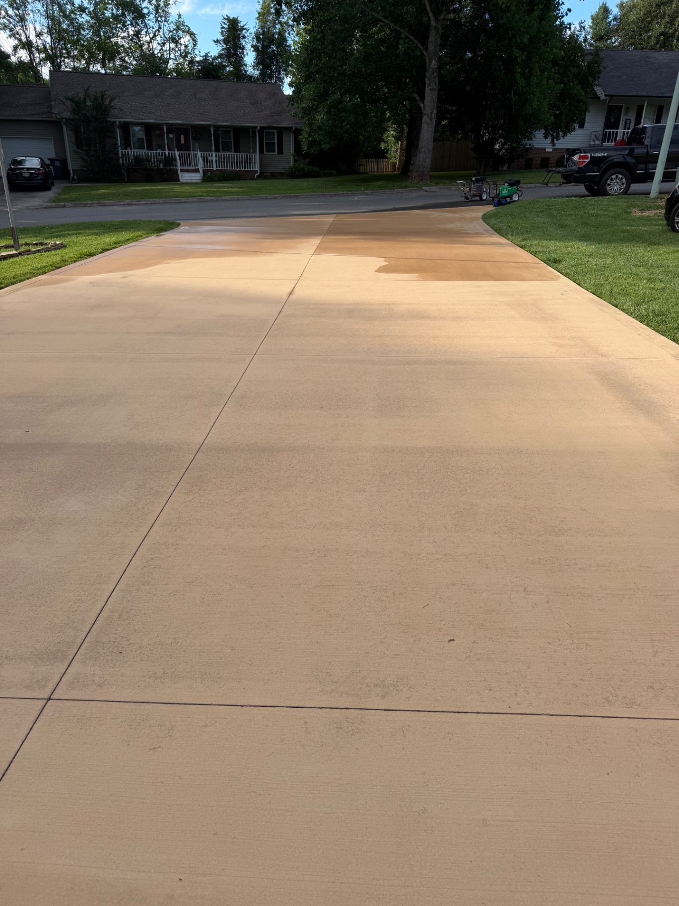 Freshly cleaned concrete driveway with a brighter finish
