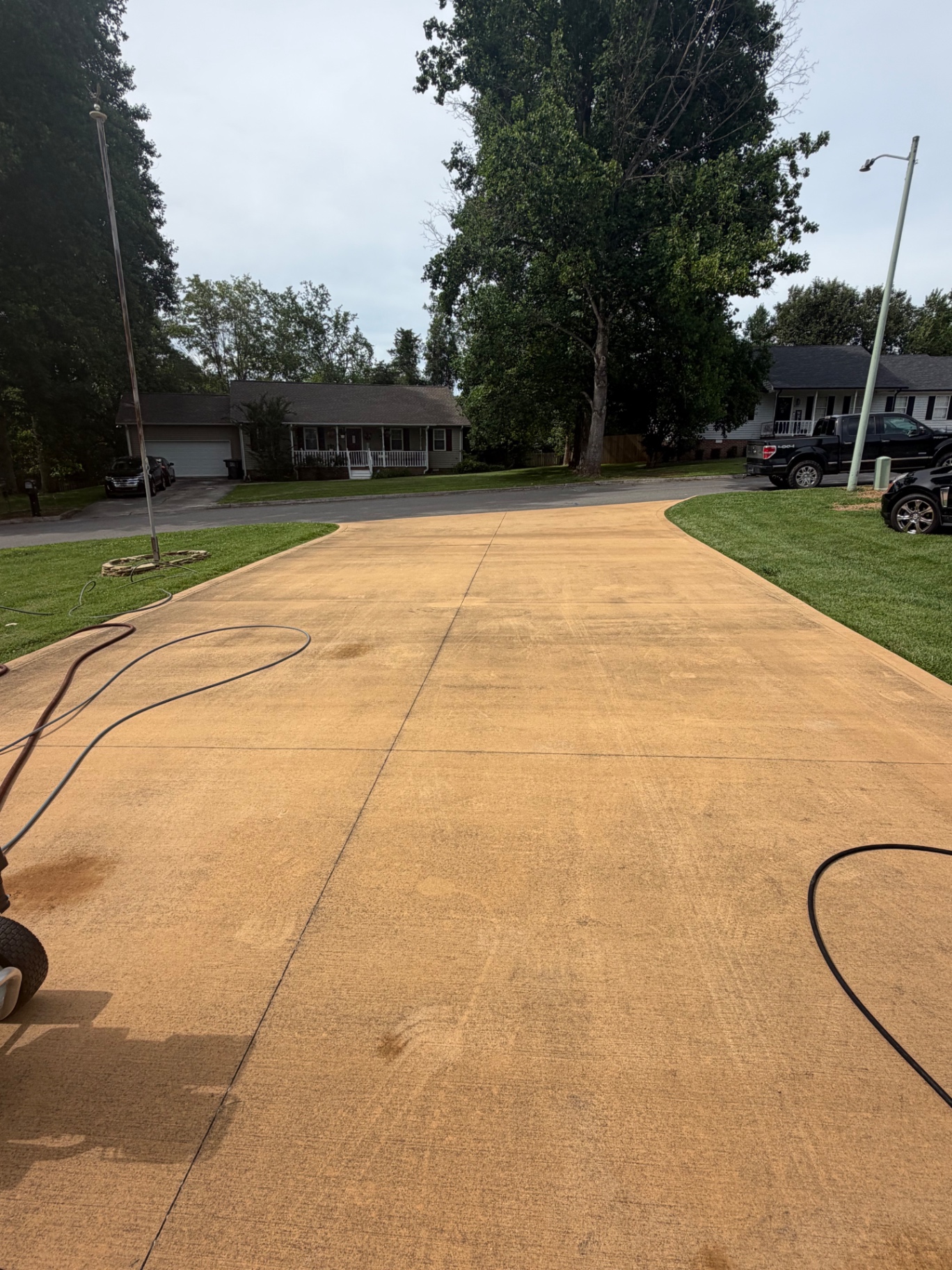 Concrete driveway before cleaning from an angled view