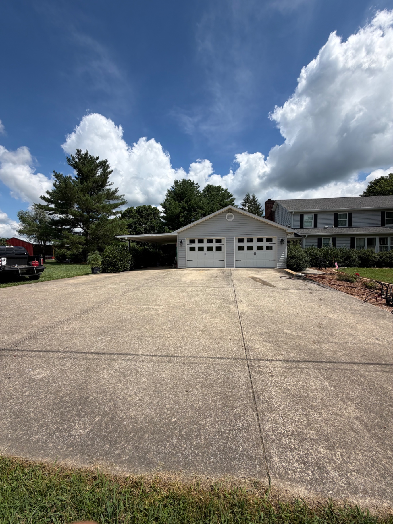 Driveway before pressure washing at a Cookeville home